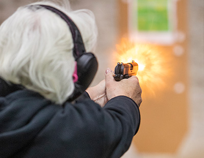 man shooting target at range