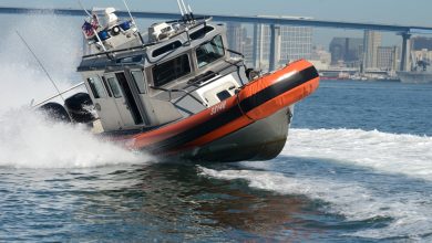 US Coast Guard shoots out migrant boat engine in high speed chase