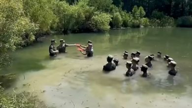 Watch these Marines reenlist in a chest-deep swamp