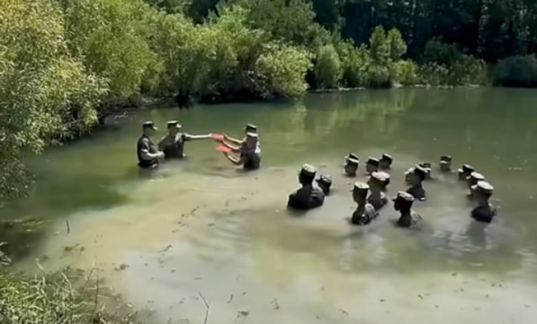 Watch these Marines reenlist in a chest-deep swamp