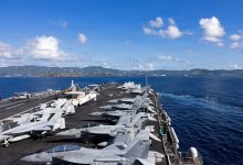 US carrier Ford to go to port temporarily after fire