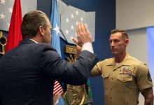 Veteran who lost both of his legs in combat reenlists in the Marine Corps