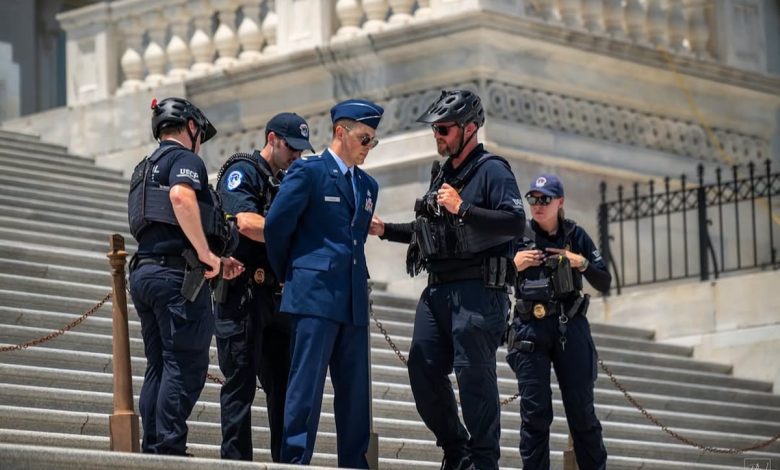 Air Force major arrested on Capitol steps during protest calling for Trump impeachment Air Force major arrested on Capitol steps during protest calling for Trump impeachment